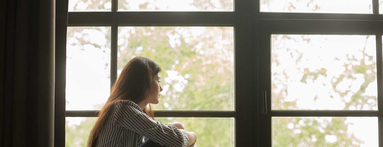 woman sitting by window